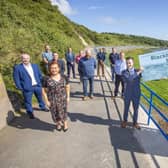 The Mayor of Mid and East Antrim, Councillor Peter Johnston, Anne Donaghy, council chief executive, elected members, FP McCann representatives and community group members at the reopening of Blackhead Path at Whitehead.