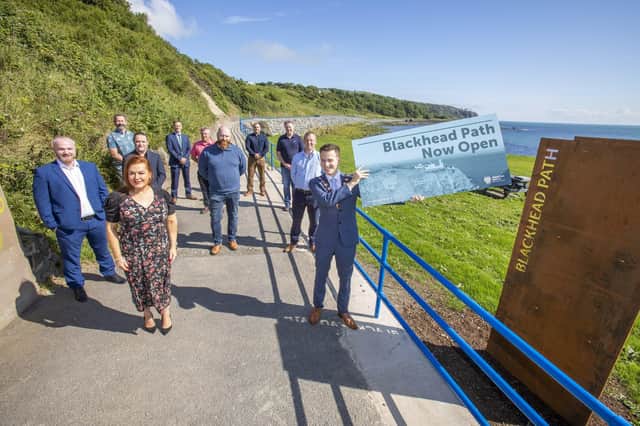 The Mayor of Mid and East Antrim, Councillor Peter Johnston, Anne Donaghy, council chief executive, elected members, FP McCann representatives and community group members at the reopening of Blackhead Path at Whitehead.
