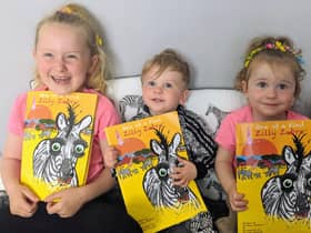 Evie, Arthur and Elsie enjoying their mum's book