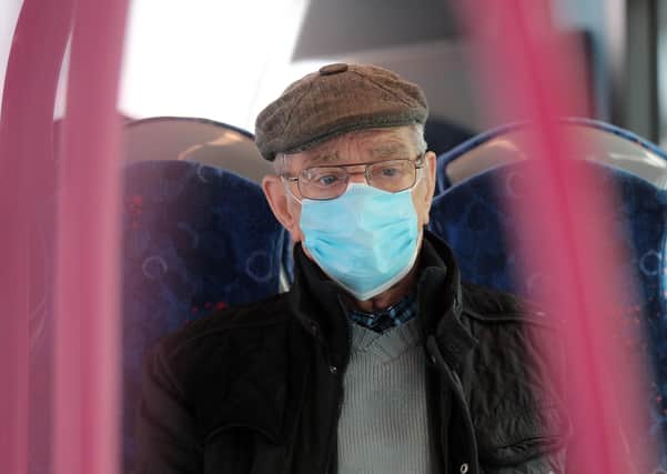 A passenger wearing a protective face mask on board a bus in Belfast. PICTURE BY STEPHEN DAVISON