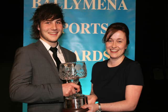 Colette Lyness of the Tower Centre presents John Andrew of the Ballymena Academy Schools cup winning team with the School Sporting Performance of the Year. INBT05-211AC