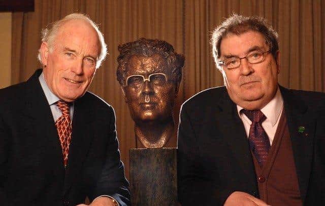 John Hume pictured with the bronze of himself and sculptor John Sherlock.