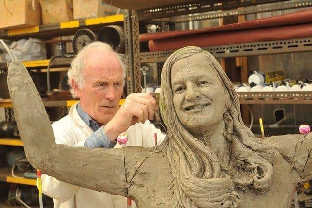 John working on his Dame Mary Peters sculpture.