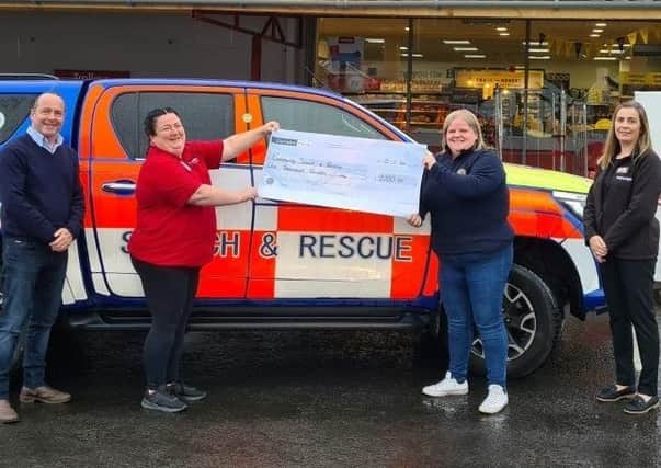 Olivia Davidson of SuperValu Kells who held a fundraiser during the pandemic for Community Search and Rescue presents Sharon from the charity with a £1000 cheque. Included is SuperValu Kells owner Peter McCool and store manager Debbie McGall.