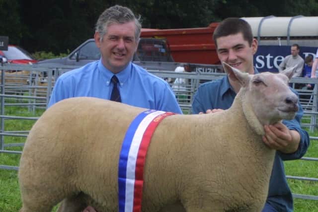 Trevor and Jim Bell with their champion Charollais sheep at the Antrim Show in 2002. Picture: Kevin McAuley