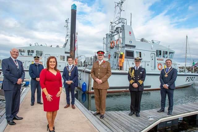 Anne Donaghy, chief executive of Mid and East Antrim Council, with (from left) Deputy Lord Lieutenant Norman Walker, Air Marshall Sean Reynolds,the Mayor, Councillor Peter Johnston, Brigadier Chris Davies, Captain Chris Smith and the Deputy Mayor, Cllr Andrew Wilson, to welcome  The Royal Navy's P2000 vessels to  Carrickfergus  marina as part of their summer deployment.