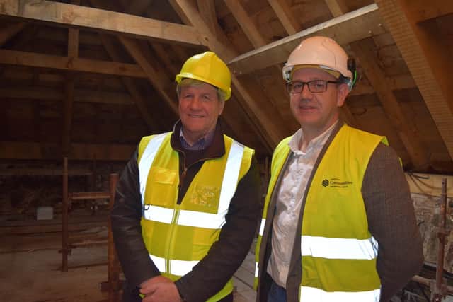 Joe Mahon (left) and archaeologist Dr John O'Keefe under the new roof at the castle.