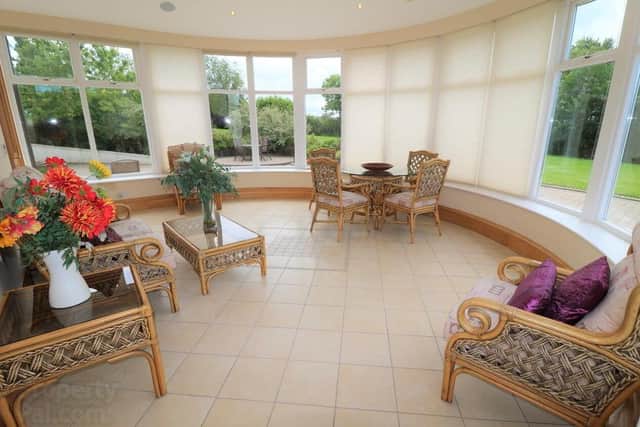 The property has five reception rooms including a sun room
