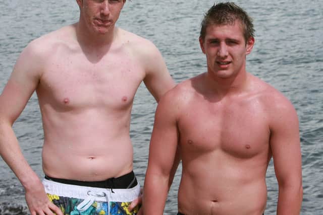 Stephen Andrews came first in the sea swimming race at Whitehead Festival 2010, pictured with his brother Gary who was second. Ct31-085tc