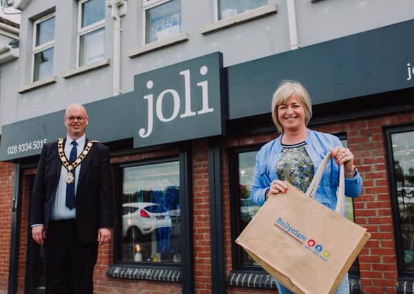 Mayor of Antrim and Newtownabbey, Councillor Jim Montgomery is pictured with Lorraine McConnell, owner of Ballyclare business, Joli Clothing. The business has recently reopened with impact following Covid-19.