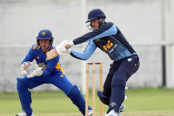 Wicketkeeper Jamie Gibson in action against Carrick