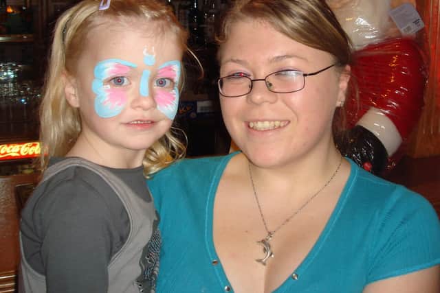 Chloe shows her newly painted face to Lesley Haveron at the Larne Masonic Centre party. LT01-804-CON