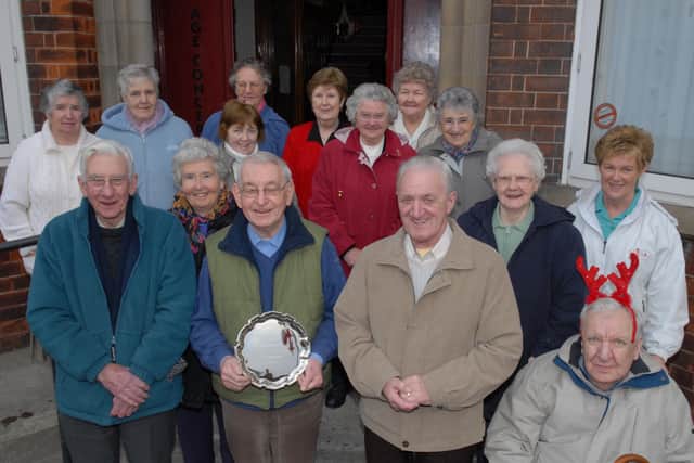 Larne Age Concern chairman Tommy Seymour and committee members pictured with a salver which was presented to the Larne club for all their hard work. LT52-436-PR