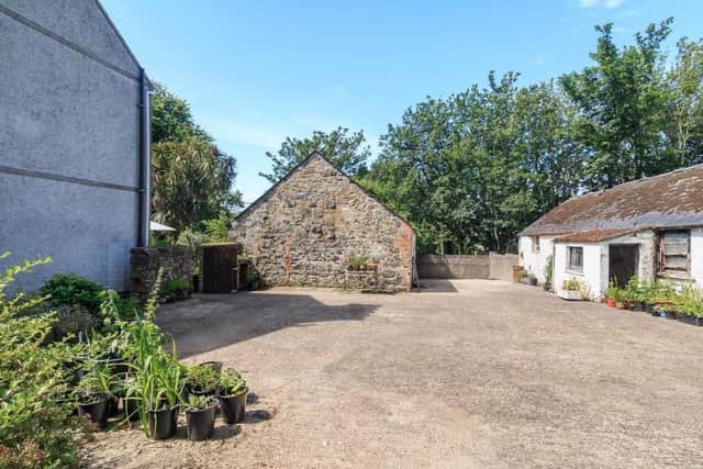 The property has an enclosed courtyard area and a large barn (with possible potential for conversion)