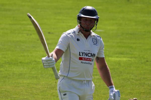 Newbuildings' Gareth McKeegan celebrates his half century during their win over Glendermott. Picture by CricketEurope