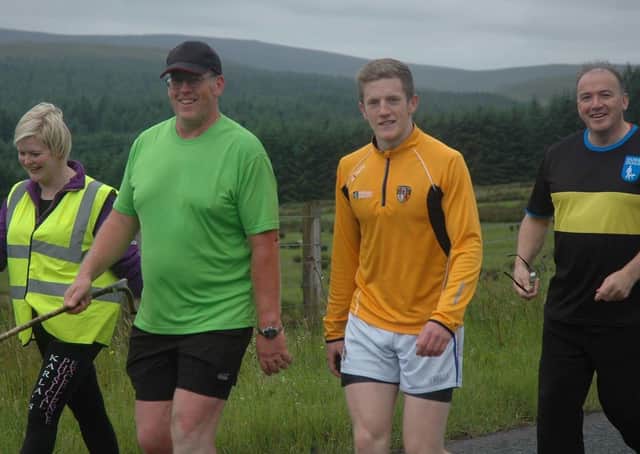 Brian and his supporters on one of his previous big walks