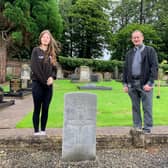 Lance Corporal Cadet Alicia McGorrey and Rev Adrian Halligan of Craig’s Parish Church Cullybackey stand beside the cleaned headstone of Gunner John McIlroy Foster