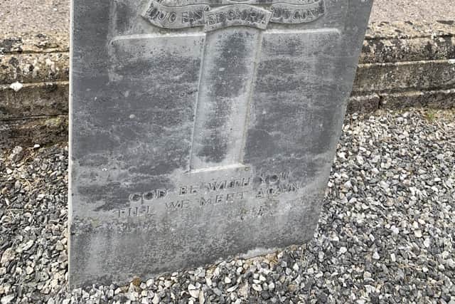 The gravestone before the clean up
