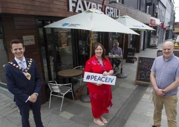 Rico Pandolf, owner of the Fayre Grill in Ballymena, along with Ursula Coll (MEA) and Mayor Cllr Peter Johnston.