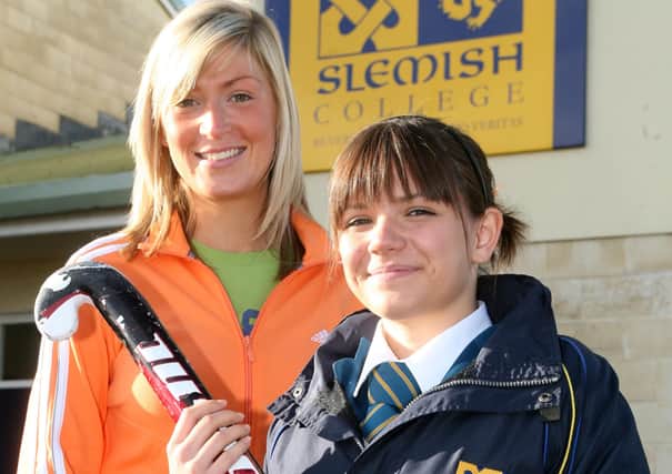 Sarah Wallace, a Year 11 student from Slemish College, who has been selected to play for the Ulster U16 squad. Looking on is Heather George (coach). BT41-208AC