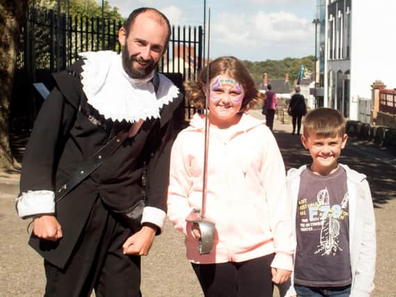 The Rev McGreggor with Giorgia Ricossa and Giacomo Ricossa, both from Italy, on Derry’s walls during the Maiden City Festival 2018, Londonderry. Picture courtesy of David Millar