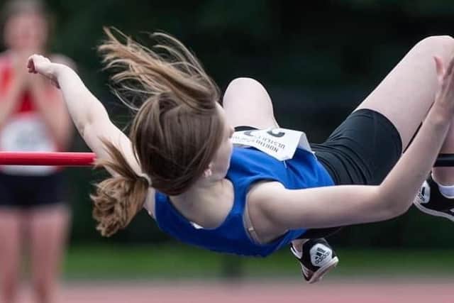 Ellie McMicheals competing in the Under 16 Girls' High Jump at the Mary Peters track.