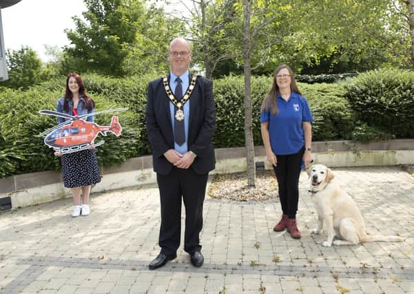 Mayor of Antrim and Newtownabbey, Cllr Jim Montgomery with representatives from his nominated charities; Grace Williams, Area Fundraising Manager with Air Ambulance NI and Sandy Hirstov, Volunteer Co-ordinator with Guide Dogs with Quaver, the retired Guide Dog.
