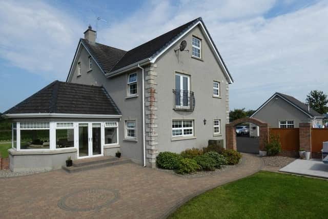 Outdoors 27 Movenis Hill, Garvagh  has numerous play/patio areas, a large rear patio/garden area bordering a meandering stream and a spacious detached double garage
