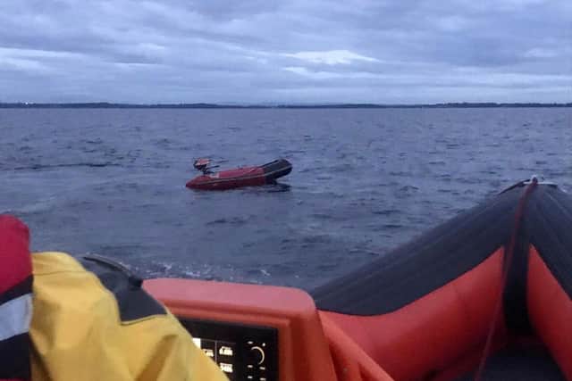 Small dingy which was carrying three people onboard on Lough Neagh.