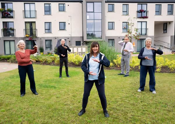 (L-R) Carol Hanna, Austin Kelly from Clanmil, Robert McCurdy and Florence Weir join Karen McStraw of the Tai Chi for Health Institute (centre) for a tai chi class at Hawthorne Gardens