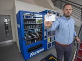 Jason Halberg, Fastenal's District Manager, demonstrates the contactless vending technology