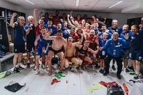 Coleraine players celebrate their historic win