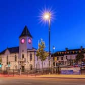 Ballyclare Town Hall lit up pink.