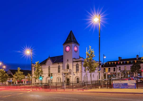Ballyclare Town Hall lit up pink.