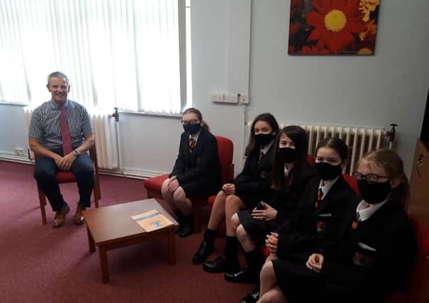Principal Charlie McAleese welcomes pupils back after lockdown to Killicomaine Junior High School in Portadown. September 1, 2020.