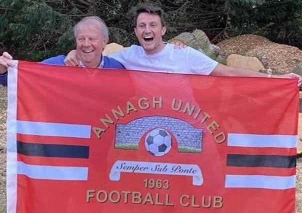 Annagh United manager Ciaran McGurgan celebrates promotion success with his father, Brian, a founder member of the club