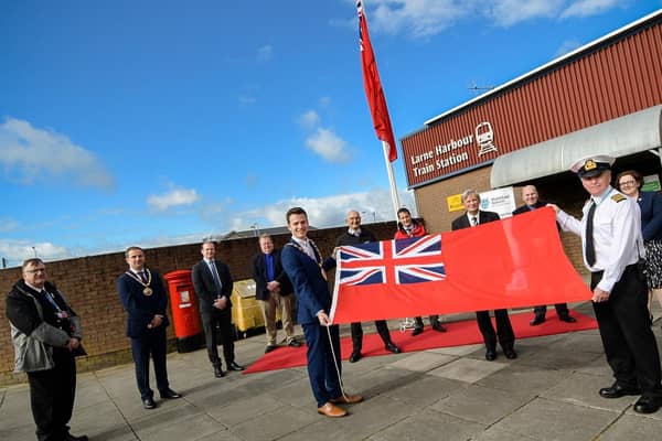 The Mayor of Mid and East Antrim, Councillor Peter Johnston; Harbour Master Stuart Wilson; the Captain of European Causeway or European Highlander; David McCorkell, Lord Lieutenant of Co Antrim and guests at the flag raising ceremony for Merchant Navy Day.