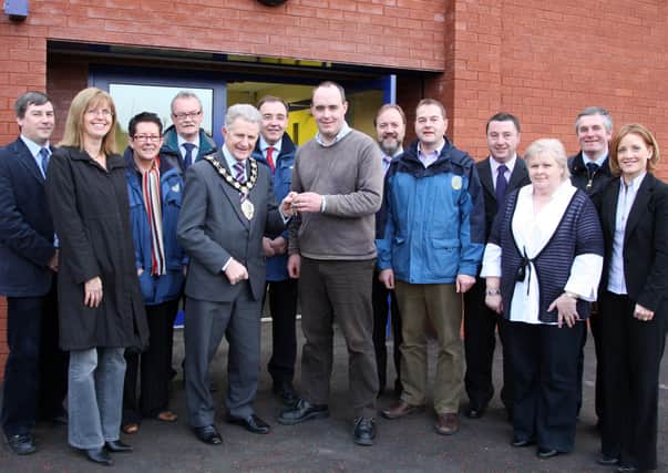 Martin & Hamilton Contracts Manager David McAdoo hands over the keys to the new extension at Ballykeel Community Centre to Ballymena Mayor Cllr Maurice Mills at last week’s ceremony which was attended by representatives of the council and the builders. Also included is caretaker Rosemary McCorkill. BT52-112JC