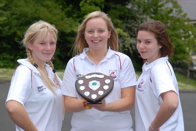 Larne Grammar School Year 12 students Rebecca Strahan and Nicole Napier have been crowned Northern Ireland Intermediate Aerobic Duet Champions. With them is their coach Judith McCabe. LT20-343-PR