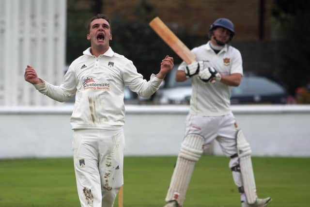 Donemana's Andy McBrine celebrates trapping Brigade batsman David Murdock. Picture by Barry Chambers
