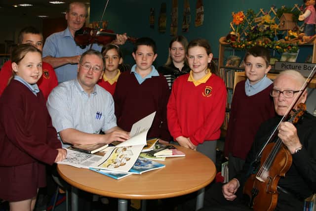 Pupils from Ballykeel and St Louis Primary Schools who attended and Ulster Scots day in Ballymena Library are seen here with Jim Millar of the Ulster Scots Agency, Ronnie Barnes, Amanda Robinson and James Christie of the Ulster Scots Experience. The day was part of a week dedicated to Ulster Scots literature, music and storytelling across the province. BT22-108JC