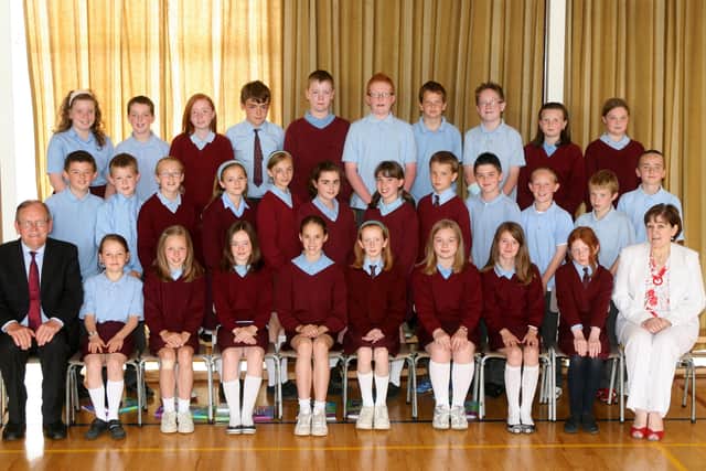 The last ever Primary 7 class from St. Louis PS with Mr. Liam Corey (Principal) and Mrs. Mary Agnew (Vice-principal). BT26-223AC
