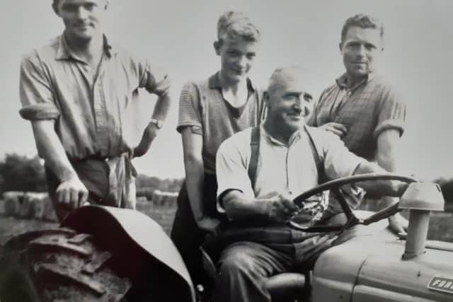 Pictured in the 1960s are Henry, Robert and James and James King Senior driving the tractor. Picture courtesy of Sheila King and the King family