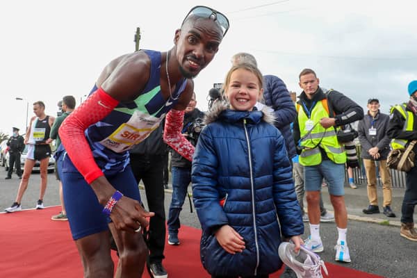 Sir Mo Farah’s appearance at the Antrim Coast Half Marathon proved a big draw for eight-year-old Mia Duddy and other fans. Pic by PressEye Ltd.