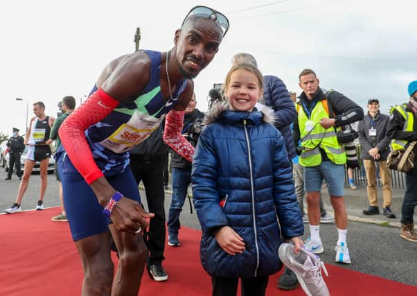 Sir Mo Farah’s appearance at the Antrim Coast Half Marathon proved a big draw for eight-year-old Mia Duddy and other fans. Pic by PressEye Ltd.