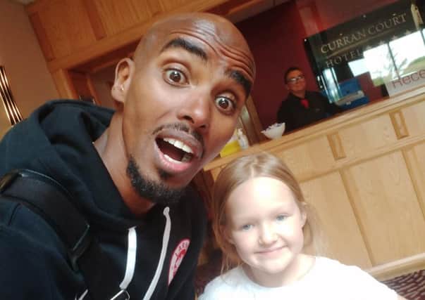 Sir Mo Farah joins Eva for a 'selfie' at the Curran Court Hotel, Larne, on Saturday afternoon.