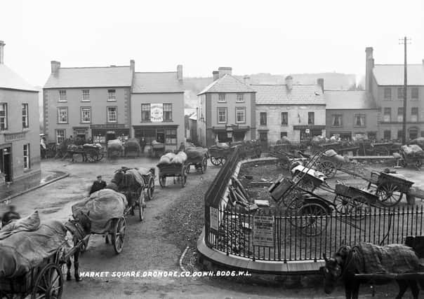 A busy Sunday at the Market Square in Dromore, 9 October 1904. Pic: ‘Reproduced courtesy of the National Library of Ireland.’