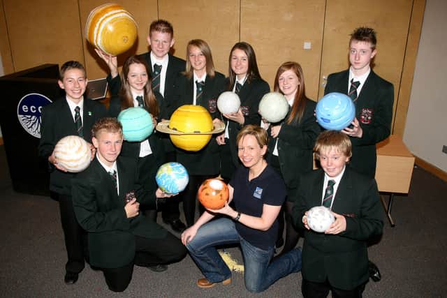 Wendy McCorry (Education Officer from the Armagh Planetarium) with pupils from Cambridge House during her science workshop "Our Fragile Planet" at the Ecos Centre. BT43-240AC