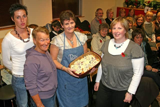 Susan Gamble, from the Pampered Chef, who gave a cookery demonstration to help raise money for the Cambridge House hockey tour and friends for Romania, is pictured with organisers Susie Dougan, Libby Henry and Jacqueline McNeill. BT46-238AC