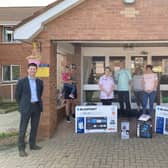Jonathan Buckley MLA alongside Mahon Hall staff and Deramore Drive residents.